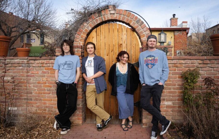 Ballpark the band posing infront of a funny door